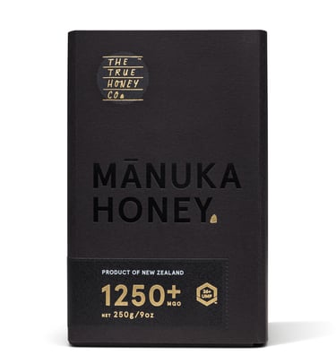 Product photography - a black box with a jar of honey inside