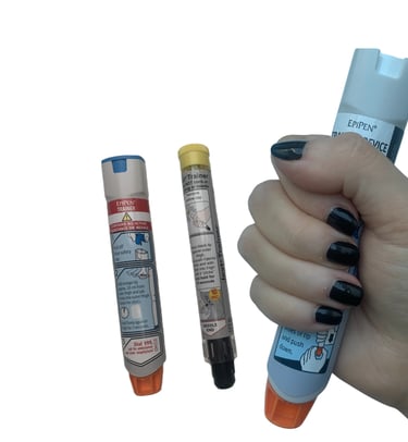 Close-up of several emergency training devices, adrenaline auto-injector for treating anaphylaxis