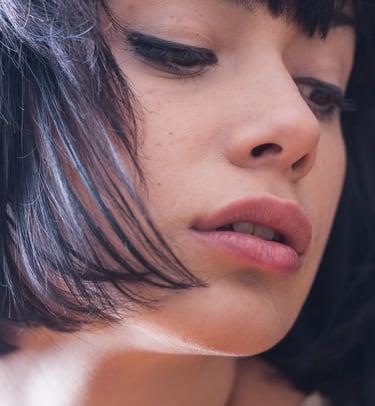 a woman with a short haircut and a short haircut