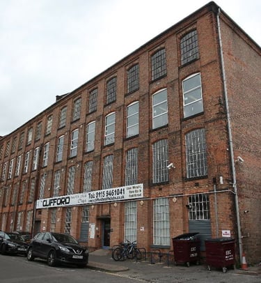 a large brick building with a sign that says,'the building is a factory