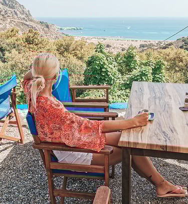 girl sits in tavern with the view