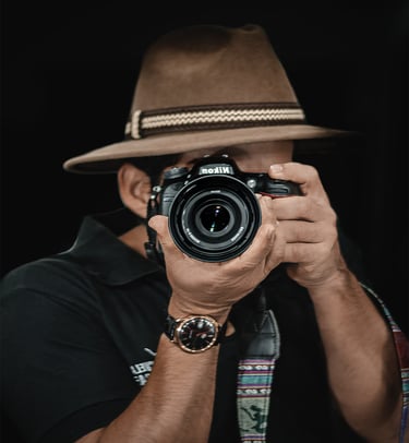 a man in a hat and a hat with a camera