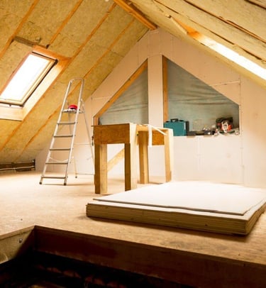 a room with a ladder and a ladder
