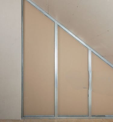 a room with a wall of exposed wall and a brick wall
