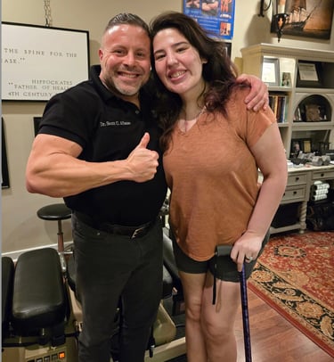 Dr. Scott Albano with a patient who has back problems.