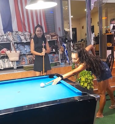 Thai women playing pool at bar near Soi 94 in Hua Hin