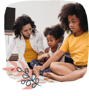 a family sitting on the floor of a living room