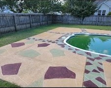 a backyard pool with a concrete patio with a pool and a pool