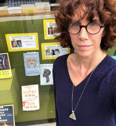 Author Dawn Davies selfie in front of a bookstore window