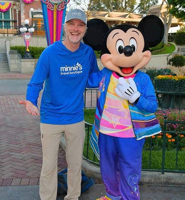 Chris Breedlove pictured with Mickey Mouse at Disneyland® Park.