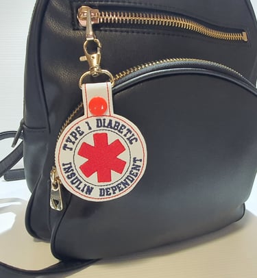 medical alert tag attached to a bag for type 1 diabetes