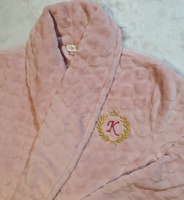This is a dressing gown that has been personalised for my customer with a wreath, crown and initial