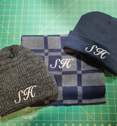 customers hats and scarf embroidered with their initials