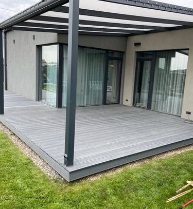 a patio with a deck and a lawn chair