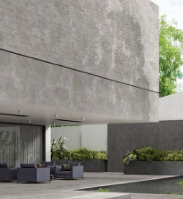 Modern minimalist patio with grey stone effect porcelain tiles on walls and floors.