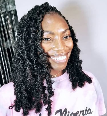 a woman with big black butterfly locs hairstyle