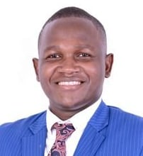 a man in a blue suit and tie