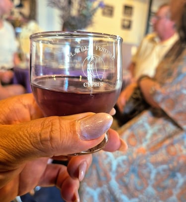 a person holding a glass of lavender squash during a Cyprus culture tour