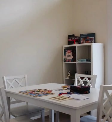 Fun and engaging games area in AFH facility designed to promote social interaction for residents.