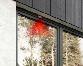 a red fire hydrant in front of a building