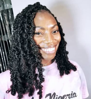 a woman with big black butterfly locs hairstyle