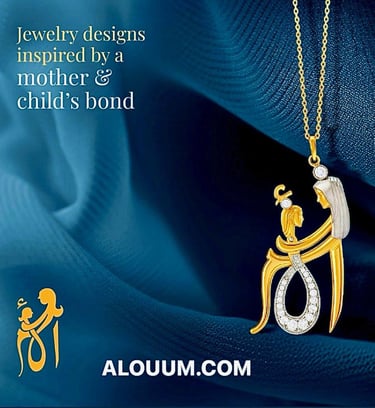 a mother and child jewelry set in gold and white