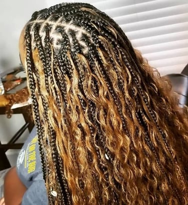 a woman with long bohobraids
