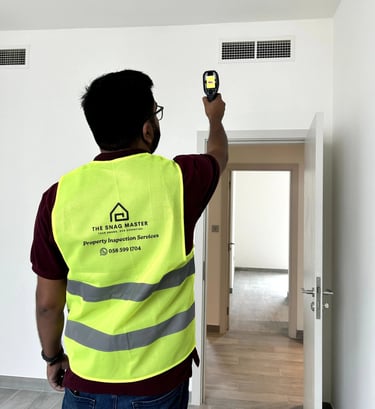 Engineer inspecting HVAC ducts during property inspection in Dubai