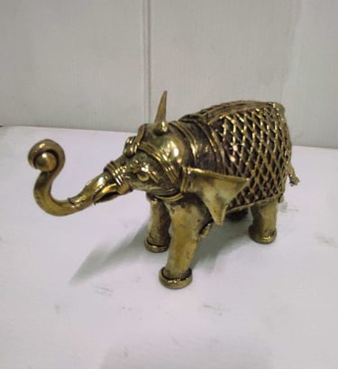 "Small brass elephant with raised trunk and intricate tribal design carvings-For international dispatch"