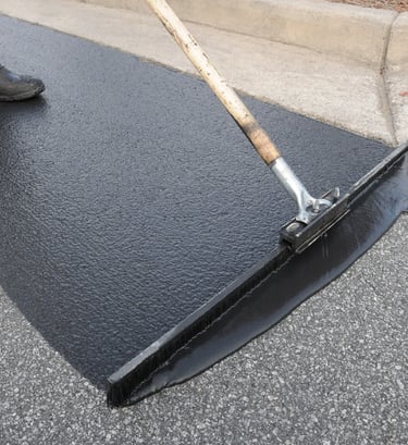 sealcoat spread on parking lot as a final finish