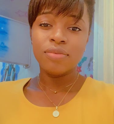a woman with a yellow shirt and a necklace