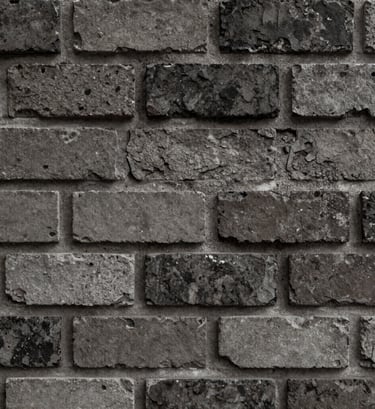Macro detail shot of weathered brick and raw concrete texture. The colors are muted #6B705C and dark #1A1A1A. Harsh, direct lighting that highlights every imperfection. Minimalist but powerful.