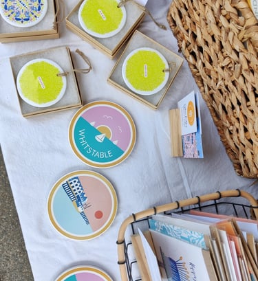 A selection of Inky Acorn Designs' coasters and ceramic decorations