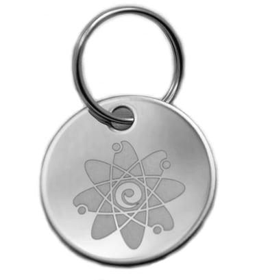 Stainless steel round pet ID tag with an engraved atomic symbol design on a metal keyring.
