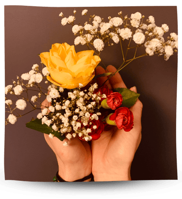 Martina holding flowers in her hands.