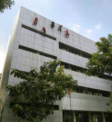 a group of people hanging from a building