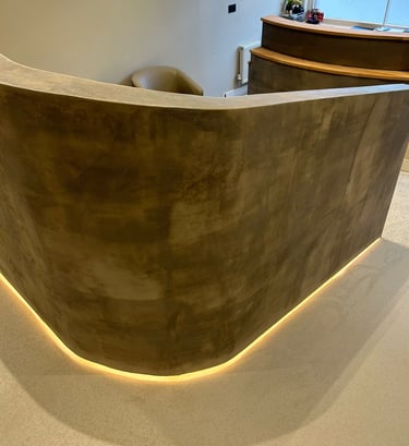 a reception table with a curved reception table