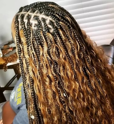 a woman with long bohobraids