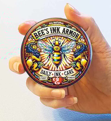Hand holding tin of all natural tattoo aftercare product Bee's Ink Armor Daily Ink Care