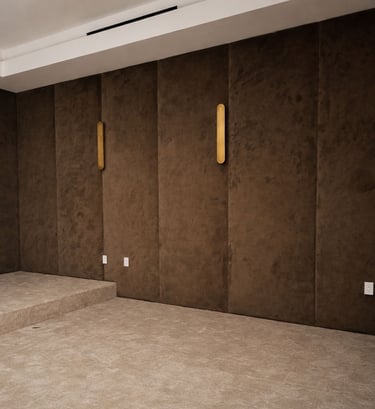 Custom dark upholstered wall panels for home theater room by Solo Home Decor