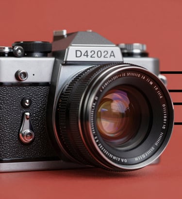 An abstract close-up of a vintage 1960s camera lens. The image uses a flat #D4202B red background with black graphic lines. The style is minimalist and bold, with visible film grain and a halftone texture on the metallic surfaces of the camera.