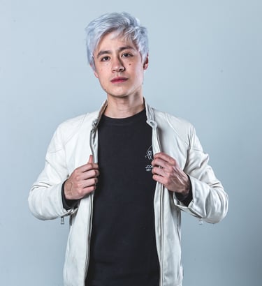 a man with a white jacket and a black shirt