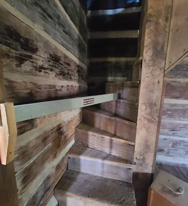 Huntsville, AL - Stairs in a cabin are barely 6 inches deep at Burritt on the Mountain