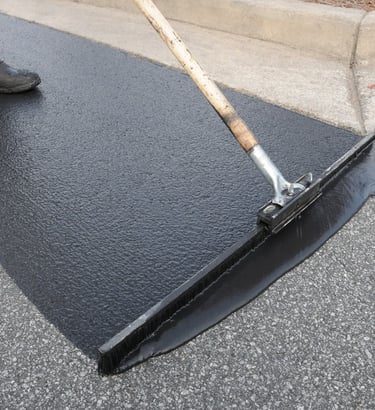 sealcoat spread on parking lot as a final finish