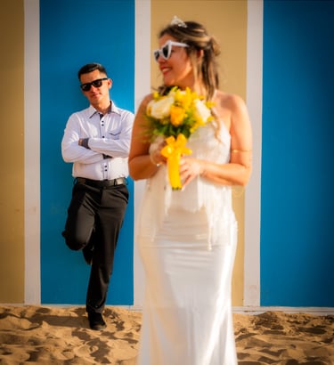 a man and woman in white wedding dress and sunglasses