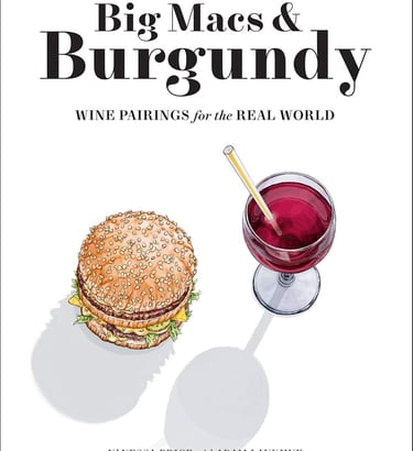 a glass of wine and a sandwich on a table