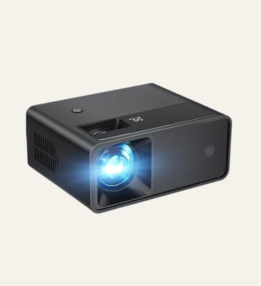 Compact black portable home theater projector with a glowing blue LED lens light.