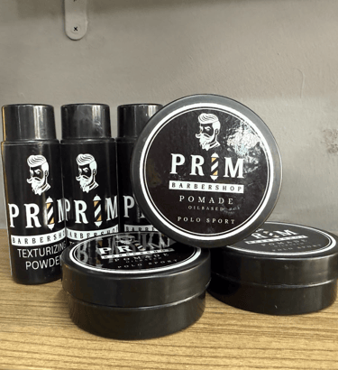 a man in a barbershop getting his hair cut