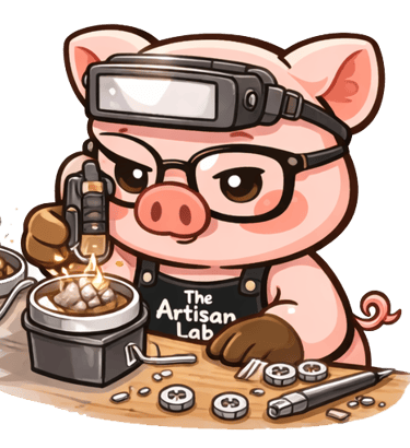 The Artisan Lab Designs mascot Milo is melting the silver with a torch