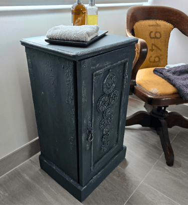 A painted vintage pot cupboard in a modern bathroom